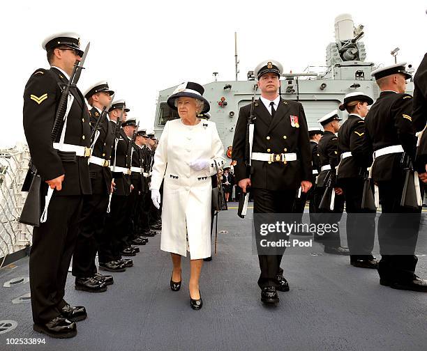 Queen Elizabeth II inspects a Guard of Honour aboard HMCS St John's on June 29, 2010 in Halifax, Canada. The Queen and Duke of Edinburgh are on an...