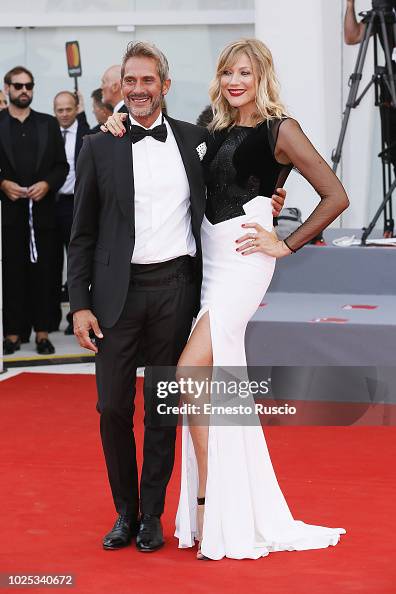 Natasha Stefanenko and Luca Sabbioni walk the red carpet ahead of the