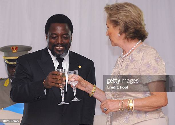 Congolese President Joseph Kabila and Queen Paola of Belgium attend a gala dinner at Cite de l'Union Africaine on June 29, 2010 in Kinshasa,...