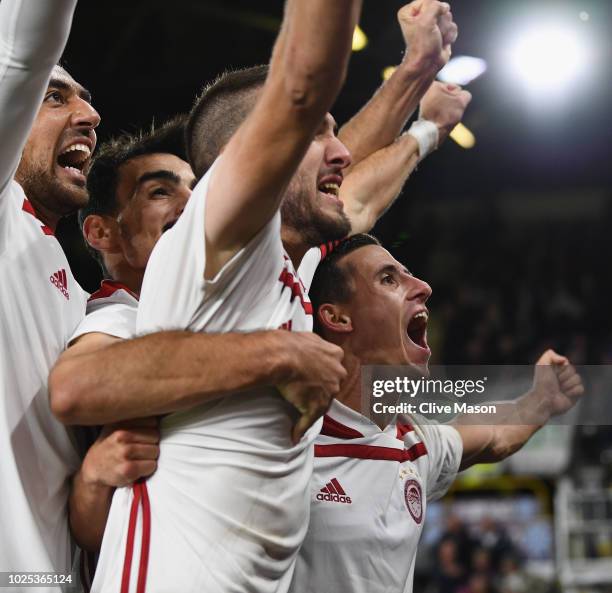 Daniel Podence of Olympiakos celebrates with team mates after scoring during the UEFA Europa League qualifing second leg play off match between...