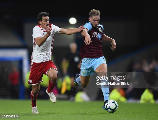 Charlie Taylor of Burnley holds off a challenge from Lazaros Christodoulopoulos of Olympiakos during the UEFA Europa League qualifing second leg play...
