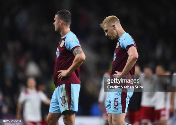 Kevin Long and Ben Mee of Burnley look dejected at the end of the UEFA Europa League qualifing second leg play off match between Burnley and...