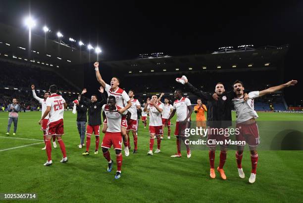 Olympiakos celebrate in front of their fans after the UEFA Europa League qualifing second leg play off match between Burnley and Olympiakos at Turf...