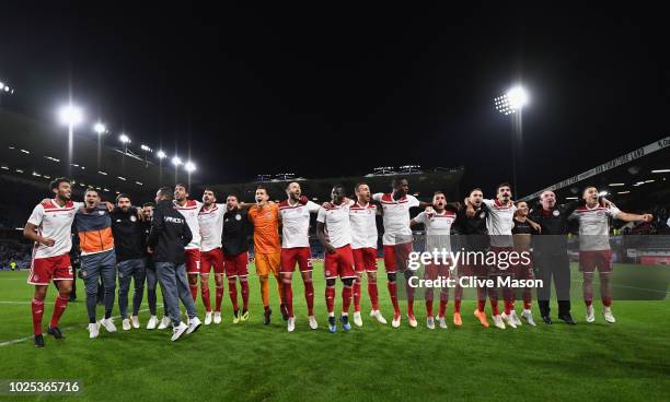 Olympiakos celebrate in front of their fans after the UEFA Europa League qualifing second leg play off match between Burnley and Olympiakos at Turf...