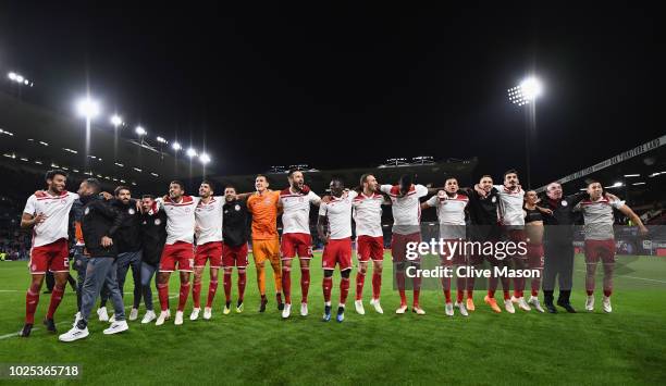 Olympiakos celebrate in front of their fans after the UEFA Europa League qualifing second leg play off match between Burnley and Olympiakos at Turf...