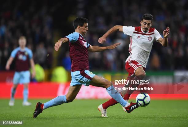 Roderick of Olympiakos is challenged by Jack Cork of Burnley during the UEFA Europa League qualifing second leg play off match between Burnley and...