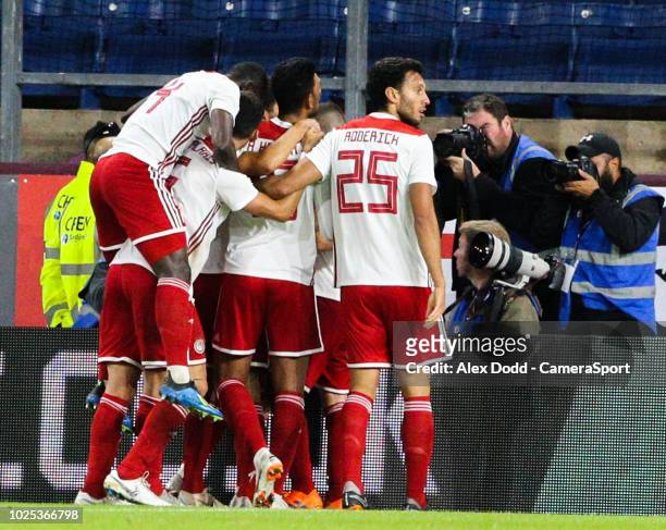 Olympiakos players celebrate scoring the first goal of the game during the UEFA Europa League Qualifying Second Leg match between Burnley and...