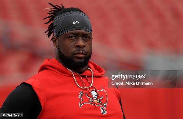 Gerald McCoy of the Tampa Bay Buccaneers warms up during a preseason game against the Jacksonville Jaguars at Raymond James Stadium on August 30,...