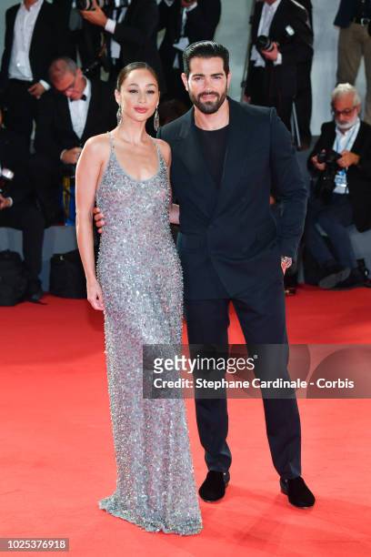 Cara Santana and Jesse Metcalfe walk the red carpet ahead of the 'The Favourite' screening during the 75th Venice Film Festival at Sala Grande on...