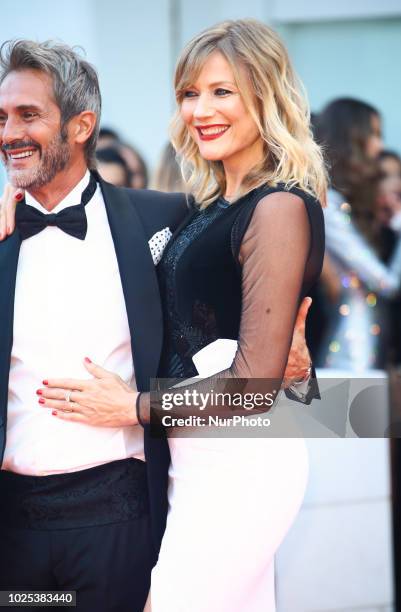 Natasha Stefanenko and Luca Sabbioni walks the red carpet ahead of the 'Roma' screening during the 75th Venice Film Festival, in Venice, Italy, on...