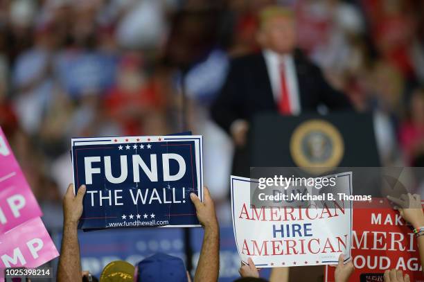 Supporters cheer U.S. President Donald Trump at a campaign rally at the Ford Center on August 30, 2018 in Evansville, Indiana. The president was in...