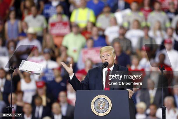 President Donald Trump tosses his notes while speaking during a rally in Evansville, Indiana, U.S., on Thursday, Aug. 30, 2018. President Donald...