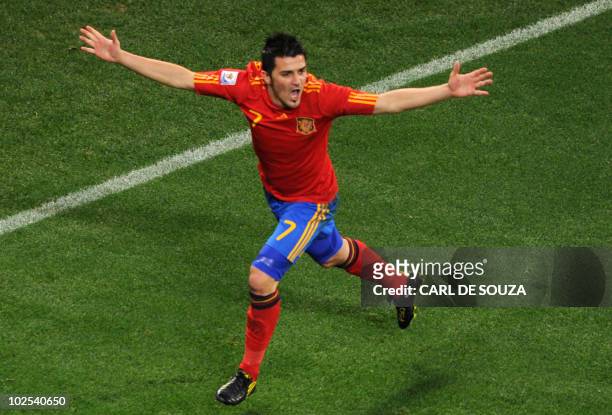 Spain's striker David Villa celebrates after scoring the opening goal during the 2010 World Cup round of 16 football match Spain vs. Portugal on June...