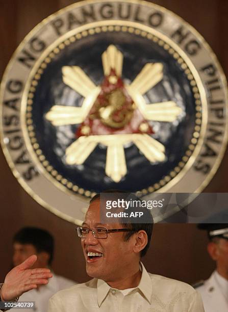 Newly inaugurated Philippine President Benigno Aquino attends his first cabinet meeting at the presidential palace in Manila on June 30, 2010....
