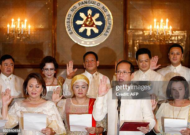 Newly inaugurated Philippine President Benigno Aquino swears-in local officials at Malacanang palace on June 30, 2010. Aquino, who was sworn in as...