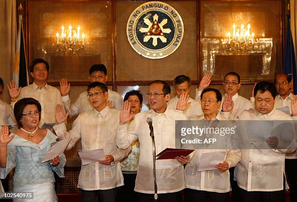 Newly inaugurated Philippine President Benigno Aquino swears-in local officials at Malacanang palace on June 30, 2010. Aquino, who was sworn in as...