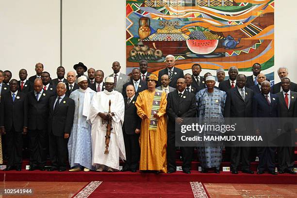 Libyan leader Moammer Kadhafi poses with leaders for a family photo at the 13th African Union summit of heads of state and government in Sirte, about...