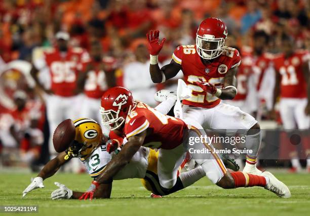 Defensive back Jordan Sterns of the Kansas City Chiefs breaks up a pass intended for wide receiver Adonis Jennings of the Green Bay Packers during...