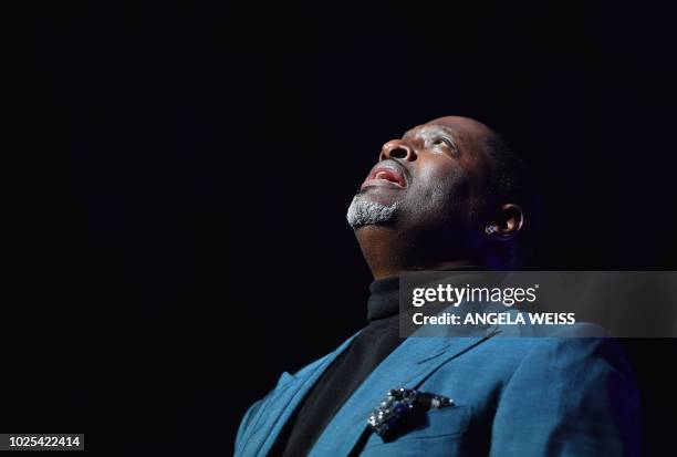 Singer Johnny Gill performs during "A People's Tribute to the Queen", an Aretha Franklin tribute event at Chene Park amphitheatre on August 30, 2018...