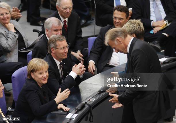 The chairman of the Greens-fraction in the Bundestag, Juergen Trittin bows low in front of German Chancellor and head of the German Christian...