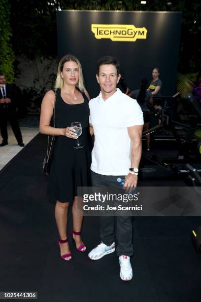 Rhea Durham and Mark Wahlberg attend Rolls Royce X Technogym at the home of Gunnar Peterson on August 30, 2018 in Beverly Hills, California.