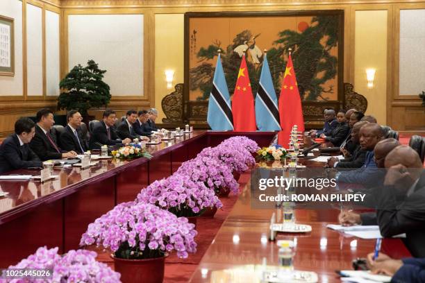 China's President Xi Jinping attends the bilateral meeting with Botswana President Mokgweetsi Masisi at the Great Hall of the People in Beijing on...