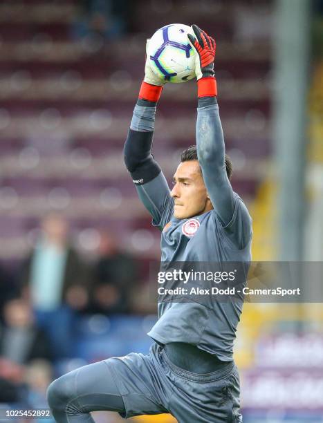 Olympiakos' Andreas Gianniotis is put through his paces in the warm up during the UEFA Europa League Qualifying Second Leg match between Burnley and...