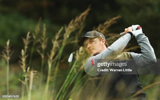 Eddie Pepperell of England plays his shot off the 16th tee during day two of the Made in Denmark played at the Silkeborg Ry Golf Club on August 31,...