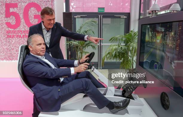 August 2018, Germany, Berlin: Dirk Wössner , Member of the Board of Management and Head of Germany at Deutsche Telekom, and Michael Hagspihl,...