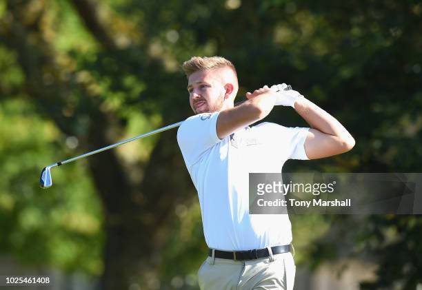 Ryan Pope of Exeter Golf & Country Club plays his first shot on the 1st tee during the final round of the Golfbreaks.com PGA Fourball Championship at...