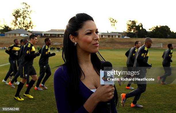 Brazilian TV presenter talks to the camera during the Brazil team training session at St Stithians College on June 30, 2010 in Johannesburg, South...