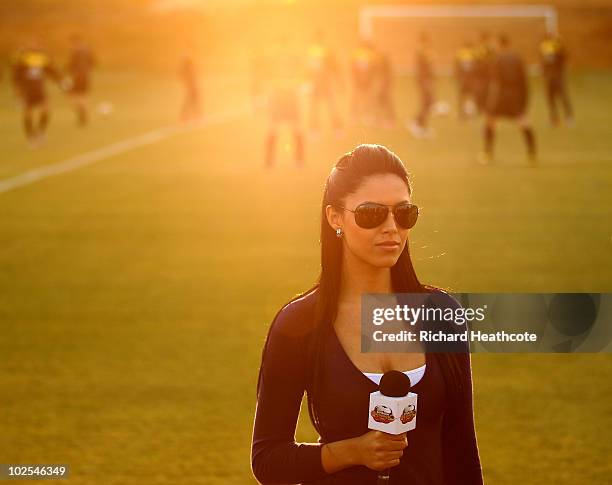 Brazilian TV presenter talks to the camera during the Brazil team training session at St Stithians College on June 30, 2010 in Johannesburg, South...