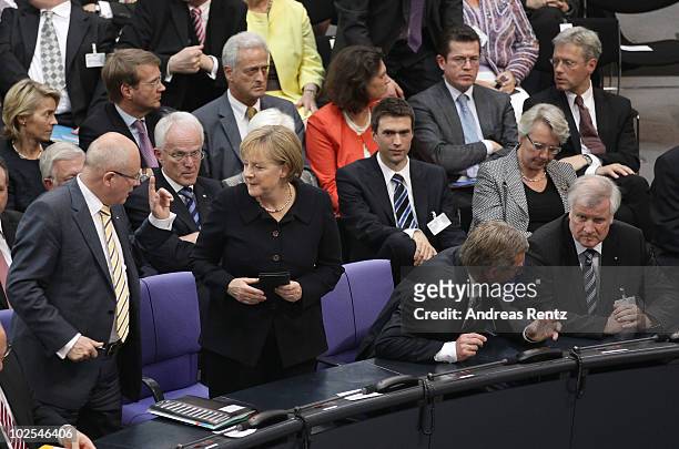 Bundestag faction leader Volker Kauder, German Chancellor and head of the German Christian Democrats Angela Merkel, presidential candidate Christian...