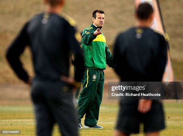 Head Coach, Dunga talks to the players during the Brazil team training session at St Stithians College on June 30, 2010 in Johannesburg, South...