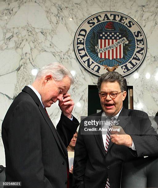 Sen. Jeff Sessions listens to Sen. Al Franken during a break on the third day of Supreme Court nominee Elena Kagan's confirmation hearings before the...