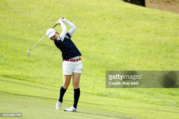 Hikari Kawamitsu of Japan hits a second shot on the first hole during the first round of the Golf5 Ladies at Mizunami Country Club on August 31, 2018...