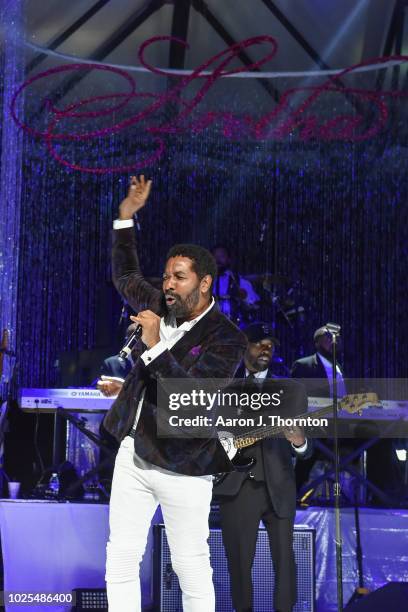 Singer Keith Washington performs on stage at a Tribute Concert to celebrate the life of songstress Aretha Franklin at Chene Park on August 30, 2018...