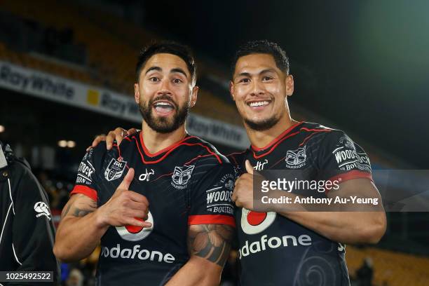 Shaun Johnson and Roger Tuivasa-Sheck of the Warriors celebrate after winning the round 25 NRL match between the New Zealand Warriors and the...