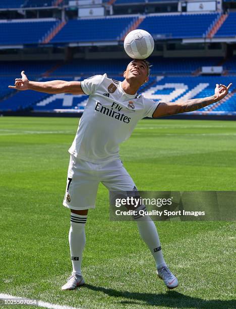 Mariano Diaz Mejia plays with a ball on the pitch after being announced as a Real Madrid player at Santiago Bernabeu Stadium on August 31, 2018 in...