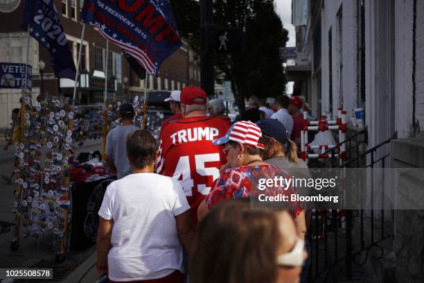 Attendees wait in line outside a rally with U.S. President Donald Trump in Evansville, Indiana, U.S., on Thursday, Aug. 30, 2018. Trump rejected a...