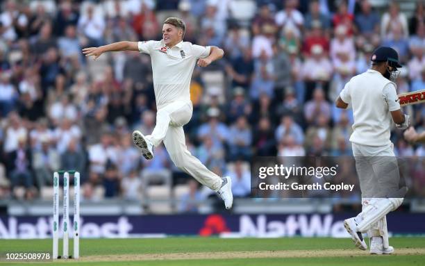 Sam Curran of England celebrates dismissing India captain Virat Kohli during day two of the Specsavers 4th Test match between England and India at...