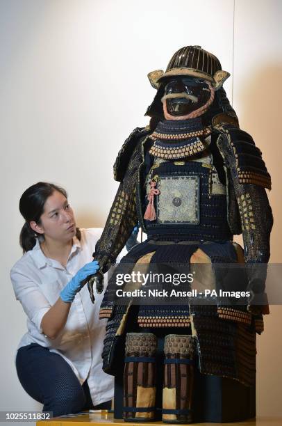 Organics conservator Tania Desloge prepares an Edo period set of Samurai armour which will be the centrepiece in the new Mitsubishi Corporation...