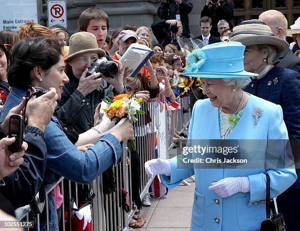 Queen Elizabeth II meets members of the public as she visits the Canadian Museum of Nature on June 30, 2010 in Ottawa, Canada. The Queen and Duke of...