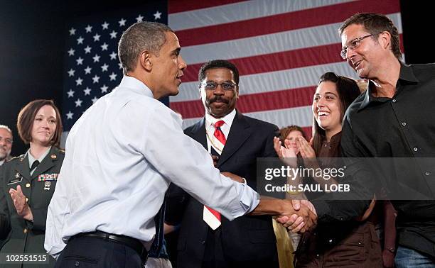 President Barack Obama greets guests after speaking during a town hall event on the economy at Racine Memorial Hall in Racine, Wisconsin, June 30,...