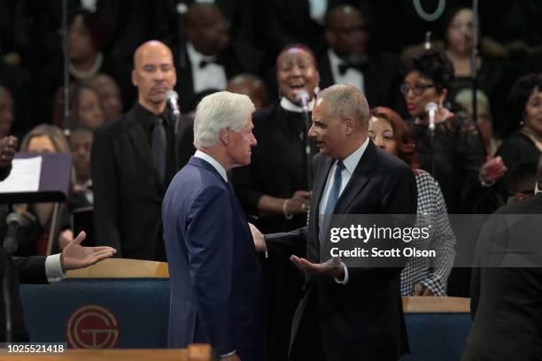 Former President Bill Clinton and former U.S. Attorney General Eric Holder attend the funeral for Aretha Franklin at the Greater Grace Temple on...