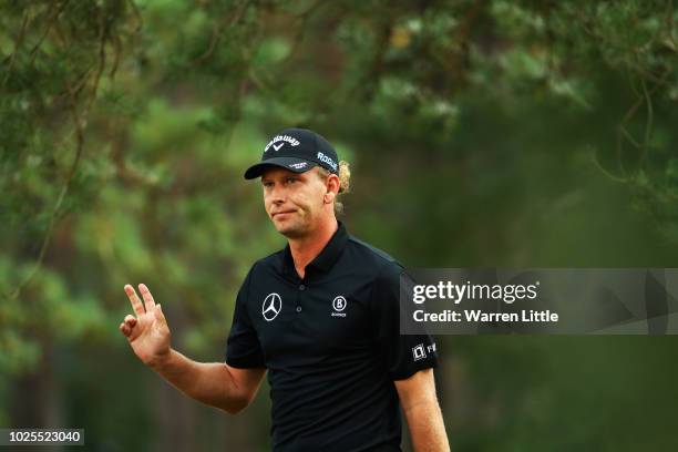 Marcel Siem of Germany acknowledges the crowd after his second shot on the 18th green during day two of the Made in Denmark played at the Silkeborg...