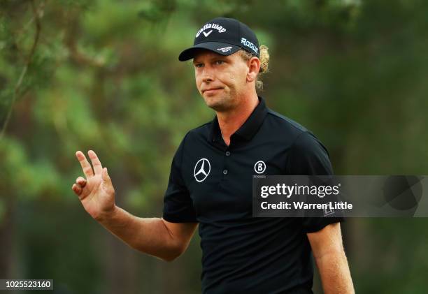 Marcel Siem of Germany acknowledges the crowd after his second shot on the 18th green during day two of the Made in Denmark played at the Silkeborg...