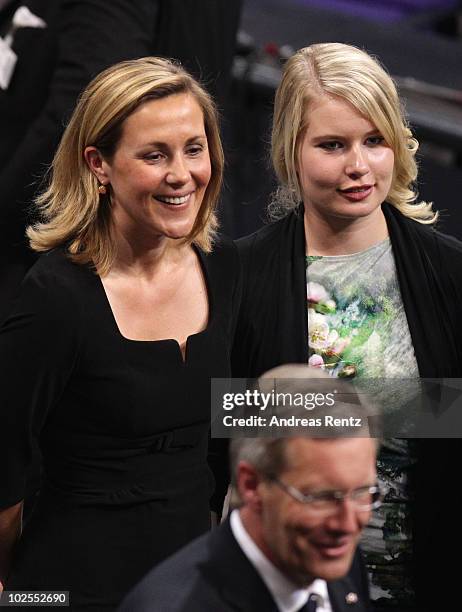 German presidential candidate Christian Wulff, his wife Bettina and daughter Annalena depart after Wulff won the third and final round of voting...