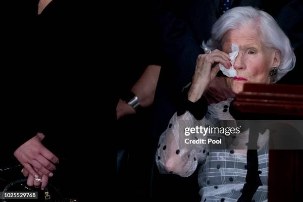 Roberta McCain, mother of, Sen. John McCain, R-Ariz., wipes her eyes as she looks at his casket as he lies in state in the Rotunda of the U.S....