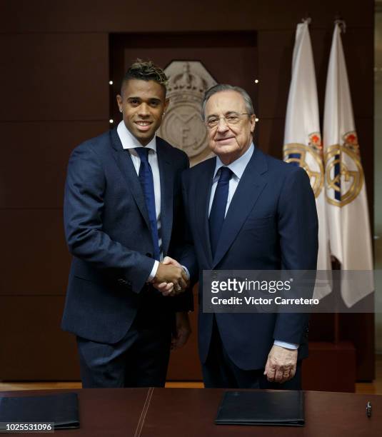 Mariano Diaz of Real Madrid poses with President Florentino Perez during his official presentation at Santiago Bernabeu stadium on August 31, 2018 in...